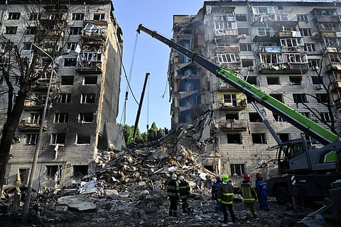 UKRAINIAN rescuers conduct a search and rescue work in a heavily damaged residential building following the Russian missile strike in Kyiv on 17 June 2025, amid the Russian invasion of Ukraine.