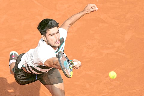CARLOS Alcaraz has survived his first test on the grass this season, booking a 6-4, 7-6 (7/4) win over Adam Walton in the opening round of the Queen’s Club Championship in London. 