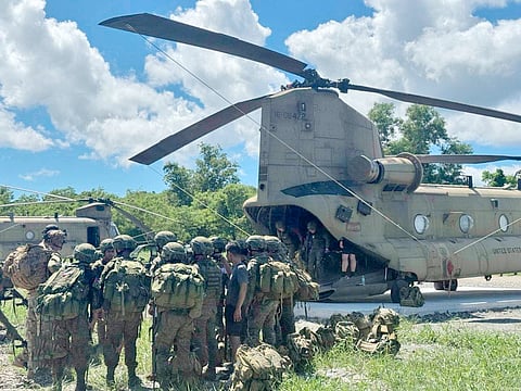 PHILIPPINE Army and US Army Pacific troops prepare to board a Chinook helicopter as part of the aerial maneuvers of the Salaknib Phase 2.