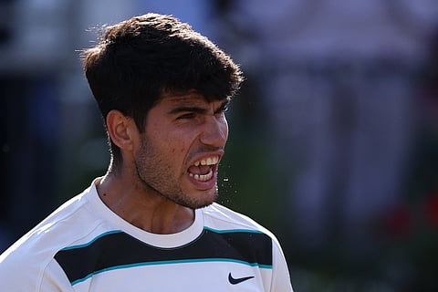 Spain's Carlos Alcaraz celebrates winning against France's Arthur Rinderknech during their men's singles quarter final tennis match at the HSBC ATP tennis Championships at Queen's Club in west London on June 20, 2025.