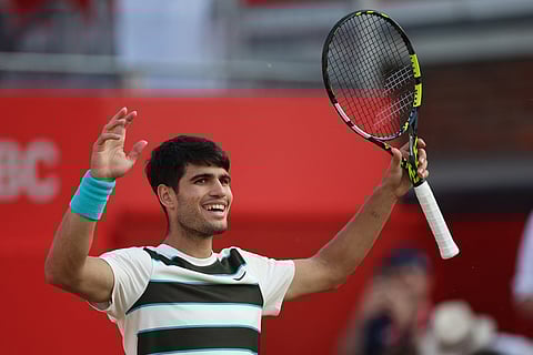 Spain's Carlos Alcaraz celebrates on match-point after beating Spain's Jaume Munar in their men's singles round of 16 tennis match at the HSBC ATP tennis Championships at Queen's Club in west London on June 19, 2025.