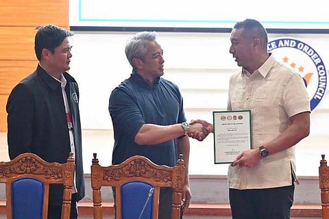 SAN Juan City Mayor Francis Zamora receives the recognition for the city’s anti-drug efforts from DILG Secretary Jonvic Remulla, as PDEA-NCR Regional Director Emerson Rosales looks on during the awarding ceremony.