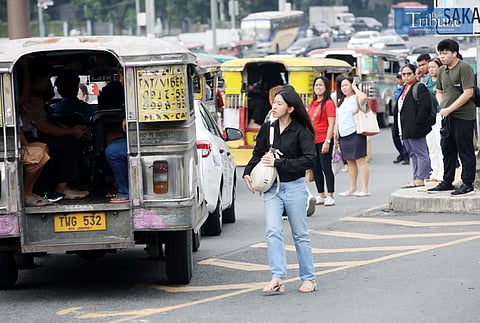 COMMUTERS wait for public transport at Philcoa, Commonwealth Avenue in Quezon City on Monday. The Land Transportation Franchising and Regulatory Board (LTFRB) said that the proposed ₱1 fare hike for both traditional and modern jeepneys remains on hold, pending the results of an economic impact study being conducted by the National Economic and Development Authority (NEDA). While the LTFRB had earlier expressed openness to approving a provisional fare increase by early July, it clarified that no adjustments have been finalized as of this time.