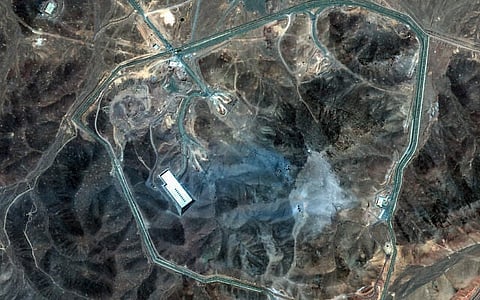 This handout satellite picture provided by Maxar Technologies, and taken on June 22, 2025, shows Iran's Fordo Fuel Enrichment Plant (FFEP), northeast of the city of Qom, after US strikes on the site.  