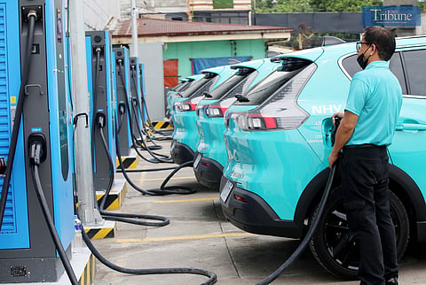 (JUNE 23, 2025)  Electric vehicle (EV) taxis units were seen charging at the garage in Caloocan City on Monday, June 23, 2025. the EV taxis run on electric motors, and a single full charge which takes about an hour and 30 minutes and travel up to 290 kilometers, Unlike traditional taxis that commonly ply Metro Manila roads using gasoline. Photo/Analy Labor