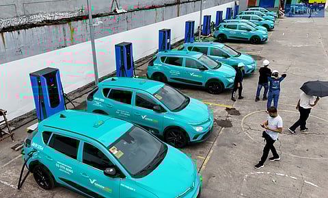 Electric vehicle (EV) taxi units are seen charging at a garage in Caloocan City on Monday, 23 June 2025. Unlike traditional gasoline-powered taxis, these eco-friendly units run on electric motors and can travel up to 290 kilometers on a full charge—which takes about an hour and 30 minutes.