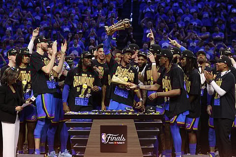 THE Oklahoma City Thunder celebrate after pulling off a 103-91 victory over the Indiana Pacers in Game 7 of the NBA Finals.  