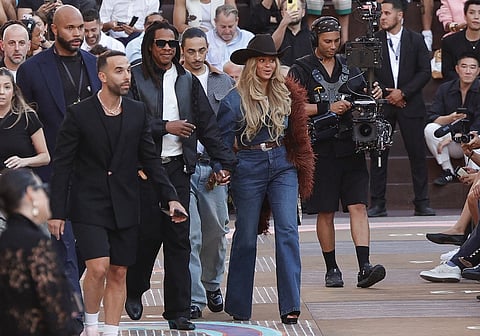 US rapper Jay-Z (C-L) and US singer-songwriter Beyonce (C-R) arrive to attend the Louis Vuitton's Menswear Ready-to-wear Spring-Summer 2026 collection fashion show as part of the Paris Fashion Week in Paris, on June 24, 2025.
