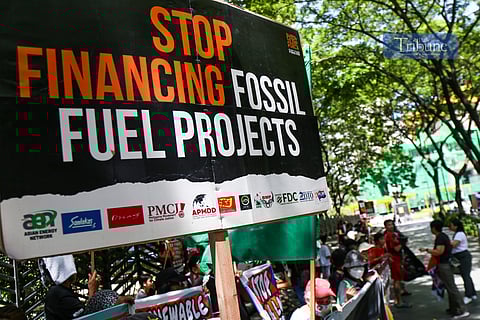 Climate advocates rally at the Ninoy Aquino Monument in Makati City on 24 June 2025, urging the Japanese government and its financiers to end support for coal and other fossil fuel projects in the Philippines and across Asia. They call instead for stronger investments in renewable energy like solar and wind.