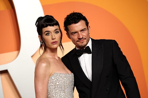US singer Katy Perry (L) and English actor Orlando Bloom attend the Vanity Fair Oscar Party at the Wallis Annenberg Center for the Performing Arts in Beverly Hills, California, on March 2, 2025.