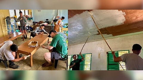 Left: U.S. and Philippine service members paint tables at an elementary school in Rizal, Palawan, on June 10 as part of Brigada Eskwela, a nationwide effort to prepare schools for the new academic year.
Right: U.S. service members team up with their Philippine counterparts in painting the ceiling of an elementary school as part of Brigada Eskwela.
