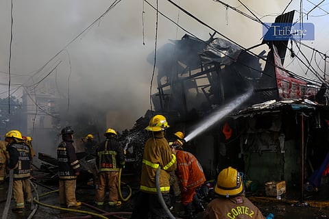 VOLUNTEER firefighters and personnel from the Bureau of Fire Protection respond to a blaze that engulfed a residential area in Barangay 772, San Andres Bukid, Manila, on the afternoon of 26 June 2025. The fire, which broke out at around 3:30 PM, quickly escalated to third alarm within 10 minutes and was declared under control by 4:20 PM