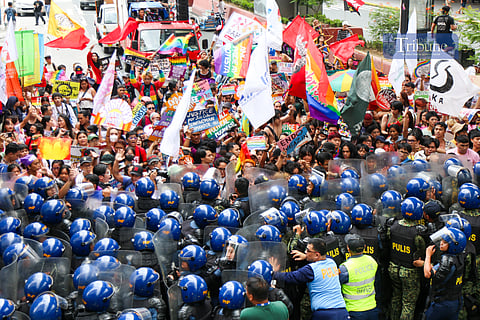 ISN'T BLUE PART OF THE RAINBOW? Policemen clash with activists along Recto Avenue in Manila on the morning of 26 June 2025. Activists commemorate "Stonewall Manila," the first LGBT Pride March in the Philippines, 31 years ago. Human rights activists call for an end to hate crimes and assault against members of the LGBTQIA+ community.
