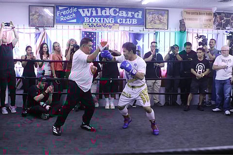 Manny Pacquiao and longtime trainer Buboy Fernandez hardly skip a beat during training.