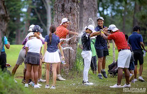Alexis Nailga gets a celebratory drenching after clinching a wire-to-wire victory in the ICTSI Del Monte Junior PGT Championship on Friday. The 16-year-old local standout overcame a shaky start in the final round but held his nerve down the stretch, capping his three-shot triumph with a clutch birdie on the last hole to the delight of hometown supporters.