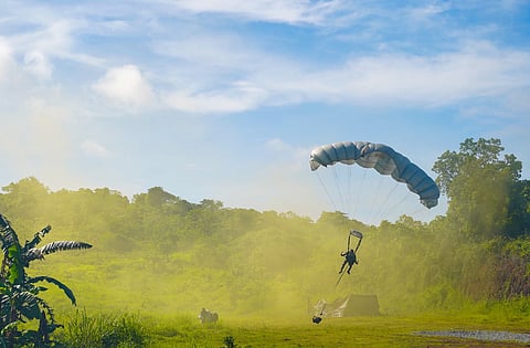 A PARATROOPER from the Special Forces Regiment (Airborne) prepares to land during a precision airborne insertion, conducted as part of the Regiment’s 63rd founding anniversary capabilities demonstration on June 28, 2025 in Fort Magsaysay, Nueva Ecija.