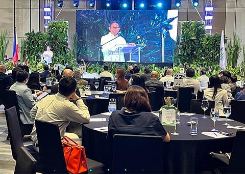 DENR Secretary Raphael Lotilla addresses environment and sustainability champions during the launch of the Sustainable Forest Land Management Agreement.