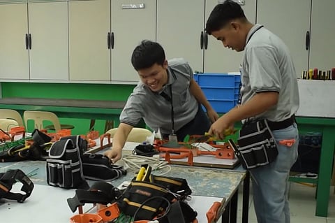 Joseph Cebedo (right) and James Manunday at the Dualtech Training Center. 