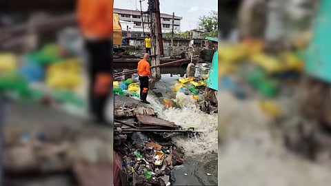 FLOODWATER breached the newly-installed sandbags in San Jose, Navotas City on Sunday, 29 June