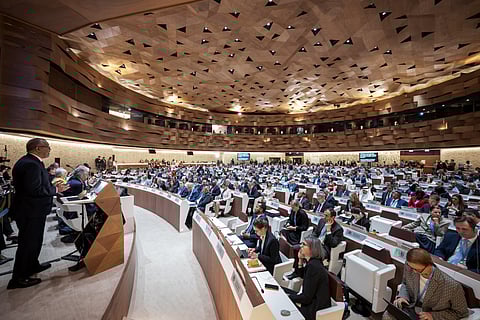 World Health Organization (WHO) Director-General Tedros Adhanom Ghebreyesus (Far L) delivers his report before delegates during the World Health Assembly in Geneva on May 19, 2025.

