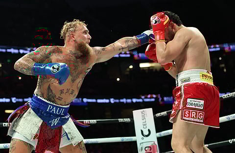 USA's Jake Paul (L) and Mexico's Julio Cesar Chavez Jr. fight during their cruiserweight boxing bout at the Honda Center in Anaheim, California, on June 28, 2025.