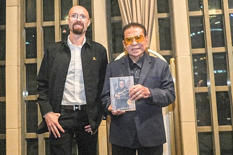 AUTHOR Maciej Mikurda and Chavit Singson.