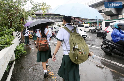 (JULY 3, 2025)  Students of Ramon Magsaysay High School in Cubao, Quezon City seen headed home after the Quezon City LGU announce the suspension of classes in the afternoon due to the bad weather, PAGASA said  A Low Pressure area LPA inside the Philippine Area of Responsibility (PAR) has a "MEDIUM" potential to develop into a tropical depression within the next 24 hours. on Thursday July 3 2025. Photo/Analy Labor