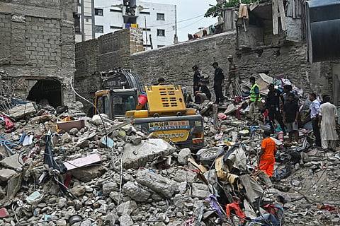 RESCUE workers conduct a search operation amid the debris of a collapsed residential building in Karachi, Pakistan on 5 July 2025.
