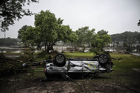 A damaged and overturned car is seen after severe flash flooding in Hunt, Texas, on 5 July 2025. Rescuers were on Saturday searching for more than 20 girls missing from a riverside summer camp in the US state of Texas, after torrential rains caused devastating flooding that killed at least 27 people -- with more rain on the way. "So far, we've evacuated over 850 uninjured people, eight injured people and have recovered 27 deceased fatalities at this time. Of these 27, 18 are adults, nine are children," said Kerr Country Sheriff Larry Leitha on 5 July.

