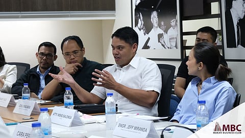 Jonji Madara (center in white shirt), president and CEO of Metro Pacific Investments Corp. subsidiary MetPower Venture Partners Holdings Inc., stresses a point regarding ways to make Waste-to-Energy technology a crucial source of electricity during a Makati Business Club forum.