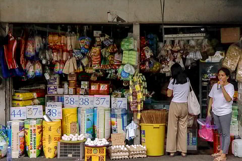 Rice prices vary at a stall inside a market in Manila.