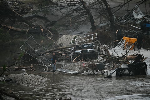 Inundated Twisted metal, broken trees and a house gutted by the Guadalupe River’s rage — remnants of Mother Nature’s sudden fury — lie scattered in Center Point, Texas, on Saturday, after flash floods surged through Kerrville, killing dozens in a summer camp.