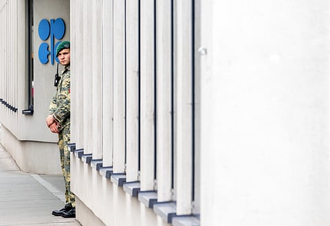 An Austrian soldier stands outside the building headquarters of OPEC (Organization of the Petroleum Exporting Countries) in Vienna, Austria, as Ministers of the OPEC+ oil alliance, led by Saudi Arabia and Russia, issued a shock decision to substantially raise output by August.