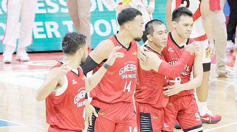 LA Tenorio (second from right) gets a hug from teammate Scottie Thompson while Stephen Holt and RJ Abarrientos look on after knocking down the three-pointer that lifted Barangay Ginebra to an 88-87 win over San Miguel Beer in Game 6 of their PBA Philippine Cup best-of-seven semifinal series. 