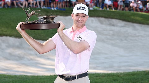 BRIAN Campbell lifts the John Deere Classic trophy following a dramatic playoff win over Emilio Grillo to collect his second US PGA Tour title.  