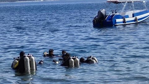 PHILIPPINE Coast Guard divers cut through the stillness of Taal Lake, expecting silt and silence — only to rise with a sack of burned bones, 
amid the search for cockfighting aficionados long feared thrown into its depths.