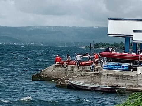 PERSONNEL of the Philippine Coast Guard prepares to scour Taal lake in Talisay, Batangas before the actual dive in search for the 34 sabungeros who were allegedly dumped somewhere in the area. 