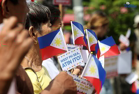 (July, 11 2025) To mark West Philippine Sea Victory Day, Akbayan group gathered at Quezon City Elliptical Road on Friday July 11 202, to hand out Philippine flags to motorists and pedestrians, as they commemorate the anniversary of the Philippines landmark 2016 Arbitral Tribunal victory. Photo/Analy Labor 