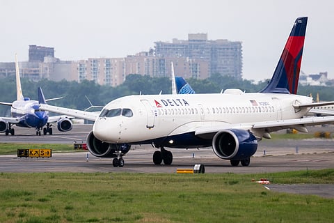 A Delta Air Lines Airbus A220 airplane prepares to takeoff at Ronald Reagan Washington National Airport in Arlington, Virginia, on July 10, 2025. Delta Air Lines stock shares surged more than 11 percent in early trading on Thursday, as the airline reported better-than-expected results. Between April and June, the group posted year-on-year sales of $16.65 billion and net income of $2.13 billion