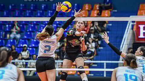 KRISH Macaslang of Nxled pierces the defense of Jewel Encarnacion of Galeries Tower during their PVL On Tour match on Tuesday. The Chameleons prevailed, 26-24, 25-23, 25-23.