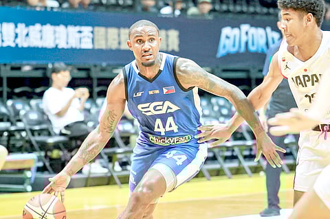 IAN Miller struggles against the suffocating Japanese defense during their 79-67 win in the 44th William Jones Cup late Monday.