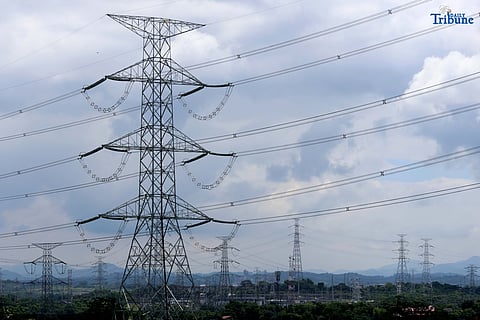 TRANSMISSION lines in San Jose del Monte, Bulacan are shown supplying electricity from power plants to substations and end-users on Tuesday. The National Grid Corporation of the Philippines (NGCP) reported that transmission wheeling rates rose slightly in June to ₱0.4611/kWh from ₱0.4593/kWh. NGCP will begin implementing the Energy Regulatory Commission's directive allowing it to recover ₱28.28 billion in under-recoveries from consumers over the next seven years.