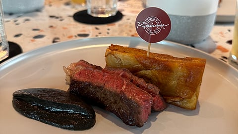 Steak and Potato Pave with California Raisin and Roasted Eggplant Sauce.