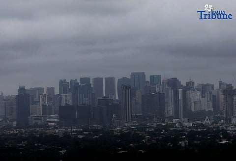 Dark clouds over Metro Manila as seen from Antipolo overview on Friday, as tropical cyclone wind Signal No. 1 was raised in more than 40 areas across Luzon as Tropical Depression Crising maintained its strength while moving toward Northern Luzon, the Pagasa said.