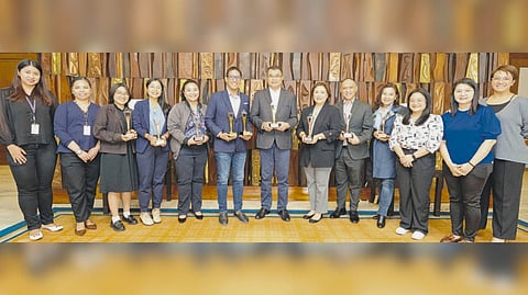 Sustainability champions. Seen in the photo (from left) One Meralco Foundation Communications Manager Sofia Monica R. Flores, Meralco sustainability executive Secretary Kristine Lei D. Jocson, sustainability programs and Communication Associate Drinna Renee D. Pepito, Subs & Affiliates Brand Governance lead Trina Francesca S. Reyes, sustainability programs head Kristine I. Rowan, first Vice President and chief sustainability officer Raymond B. Ravelo, executive vice President and chief operating officer Ronnie L. Aperocho , first Vice President and head of Customer Retail Services Charina P. Padua, One Meralco Foundation President and chief corporate social responsibility officer Jeffrey O. Tarayao, vice President and head of Marketing and Brand Experience Edeliza T. Lim, Subs & Affiliates Brand Governance associate Camille L. Ignacio, Subs & Affiliates Brand Governance associate Marian Irish R. Viado, and head of Brand Experience Management Jennifer Anne E. Aberin.