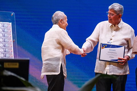 BDO Foundation President Mario Deriquito receives the Outstanding BSP Stakeholder award from BSP Monetary Board Member Romeo Bernardo during the 2025 OBSAC ceremony held at the BSP head office on 18 July 2025.