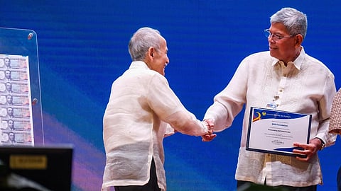 BDO Foundation president Mario Deriquito (right) receives the Outstanding BSP Stakeholder Award from BSP Monetary Board member Romeo Bernardo during the 2025 OBSAC ceremony held at the BSP headquarters.