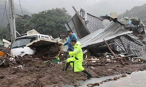 A LANDSLIDE triggered by heavy monsoon rains buried homes in Sancheong county, South Korea, killing one and leaving three others missing.
