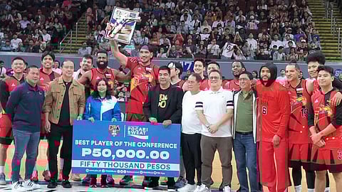 JUNE Mar Fajardo of San Miguel Beer (middle) raises his plaque after emerging as Best Player of the Conference in the PBA Philippine Cup last Sunday at the Mall of Asia Arena.