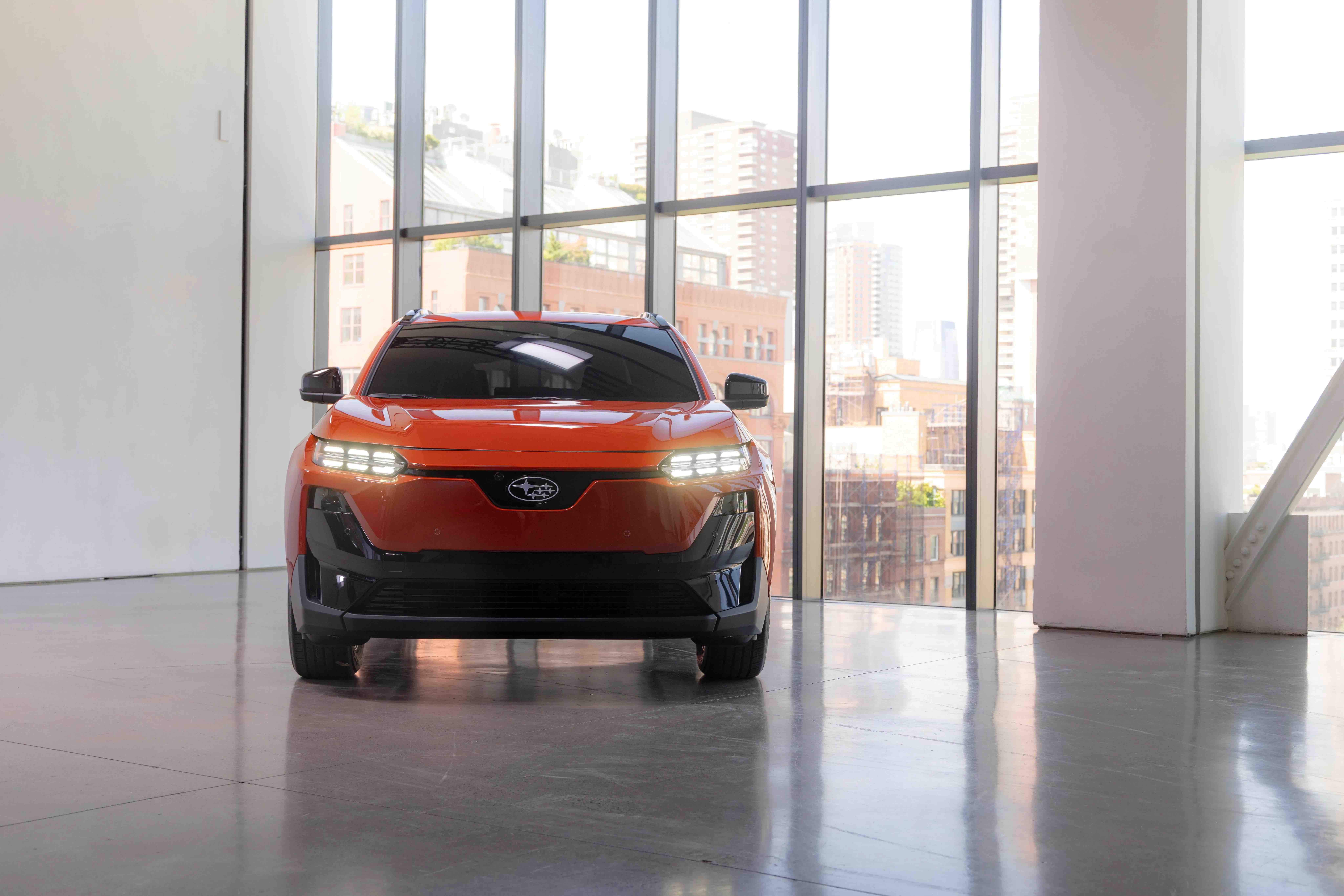 FRONT view of the all-electric Subaru Uncharted with its signature six-star badge and LED lighting.